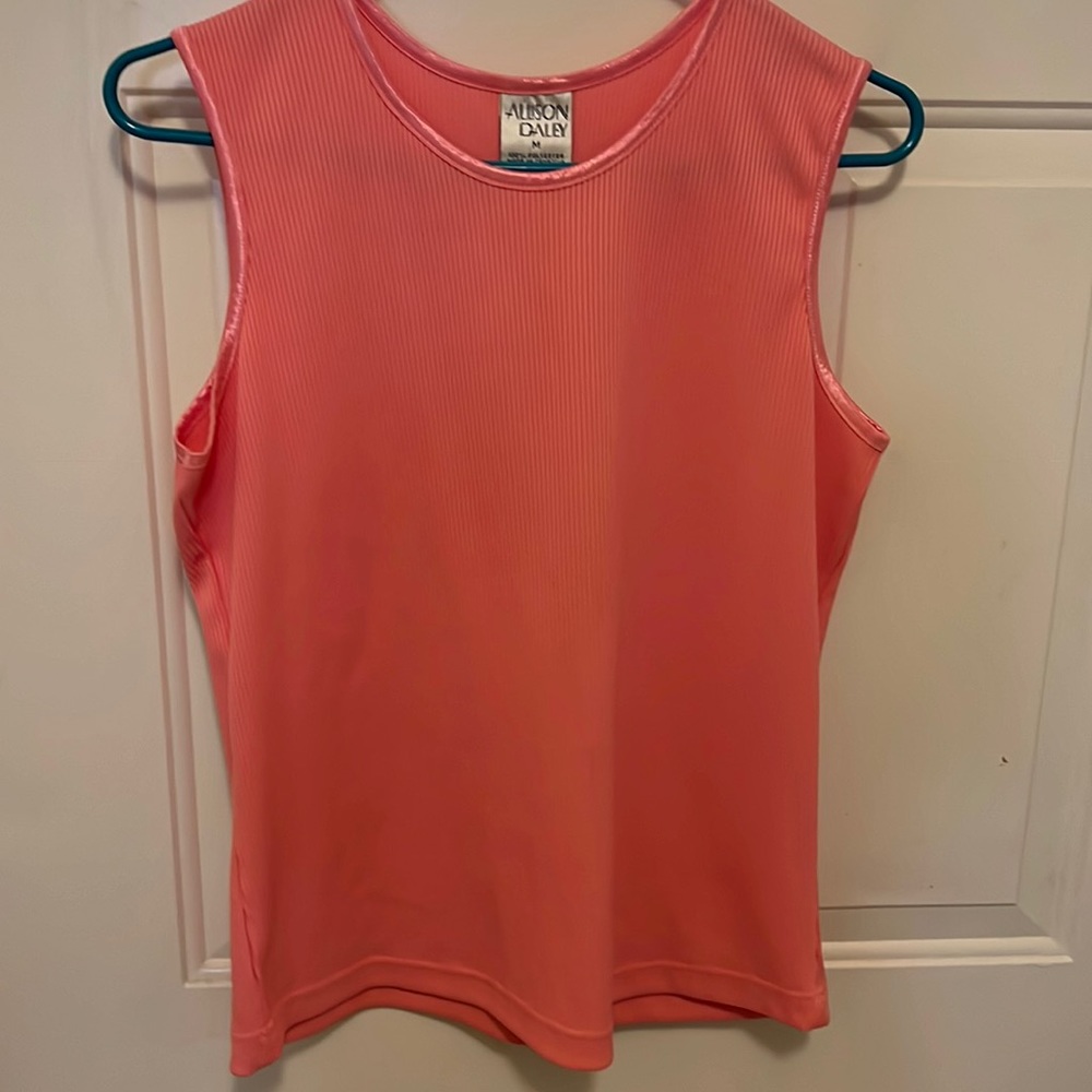 Medium .. teal shirt is petite M.  Shorter in length.